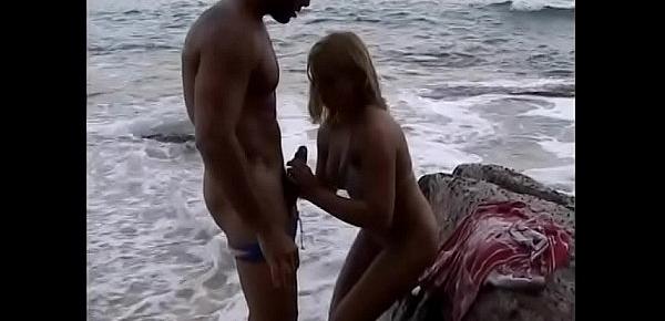  Naughty blonde MILF with big knockers Leandra is not against to be  navigated the windward passage on the warm sand  near the ocean line
